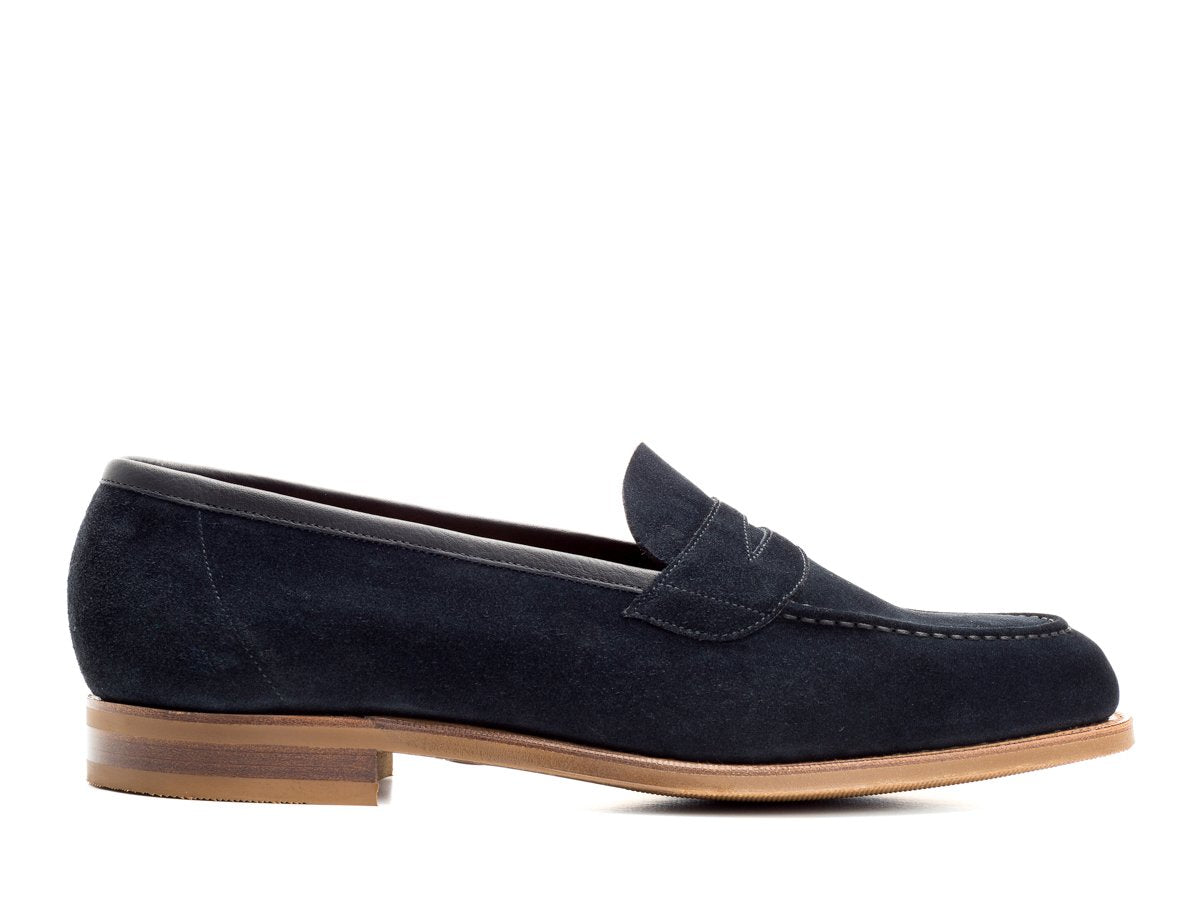 Side view of Edward Green Ventnor penny loafers in navy suede