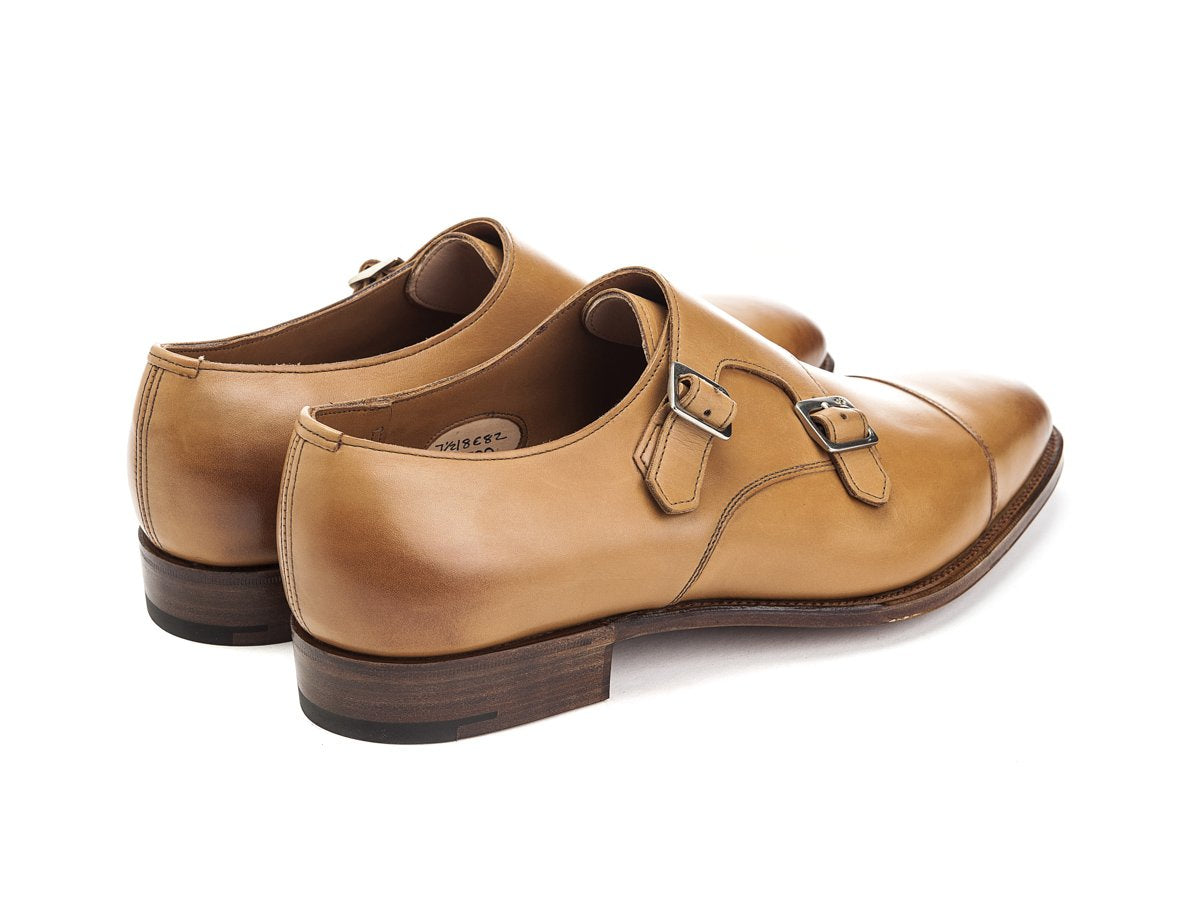 Back angle view of Edward Green Westminster plain captoe double monk strap shoes in acorn antique calf