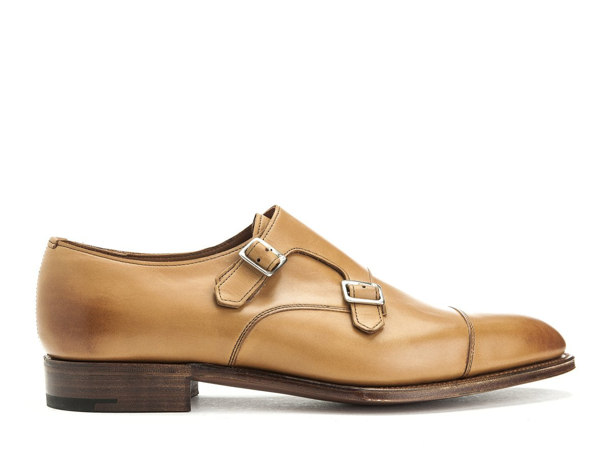 Side view of Edward Green Westminster plain captoe double monk strap shoes in acorn antique calf