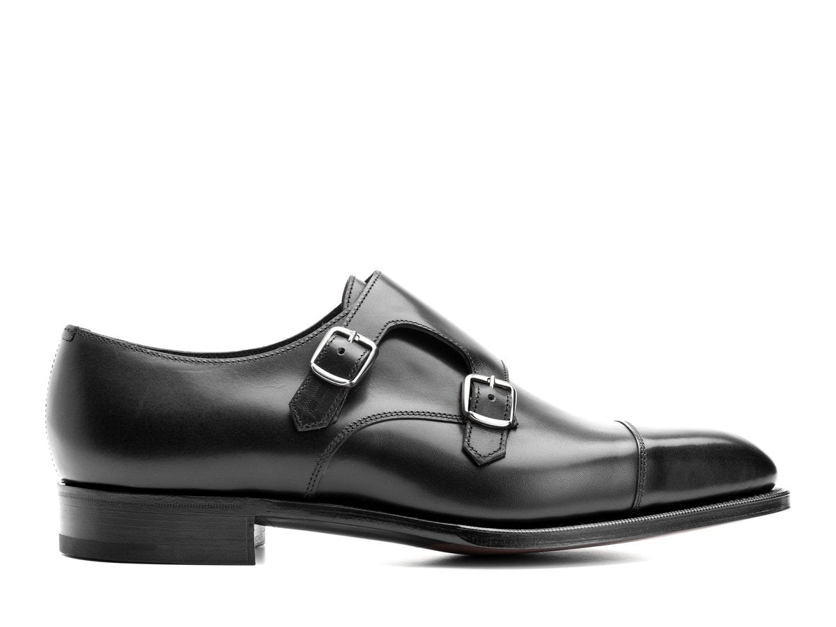 Side view of Edward Green Westminster plain captoe double monk strap shoes in black calf