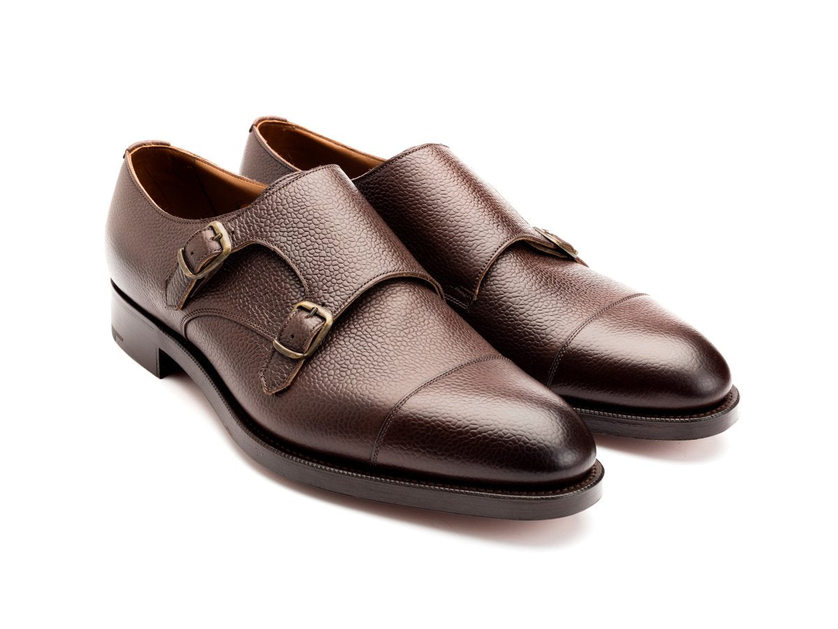 Front angle view of Edward Green Westminster plain captoe double monk strap shoes in walnut country calf