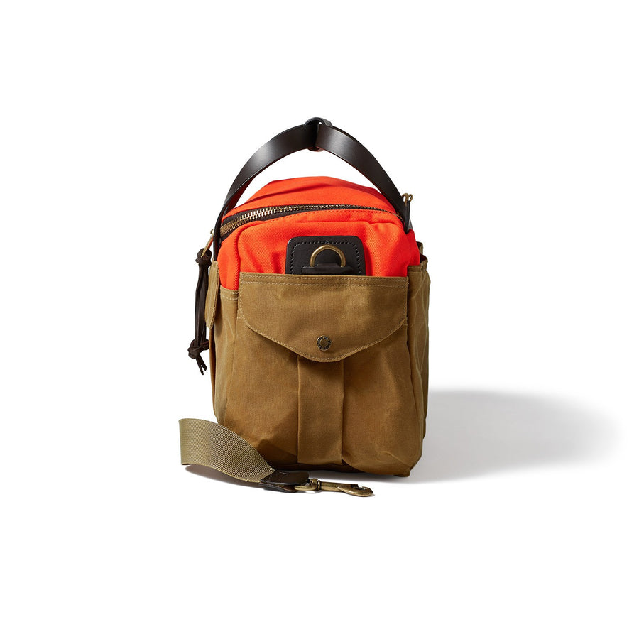 Side view of Filson Heritage Sportsman bag in orange and dark tan