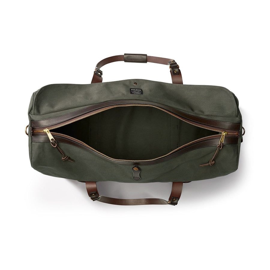 Top view of unzipped Filson Large Duffle bag in otter green