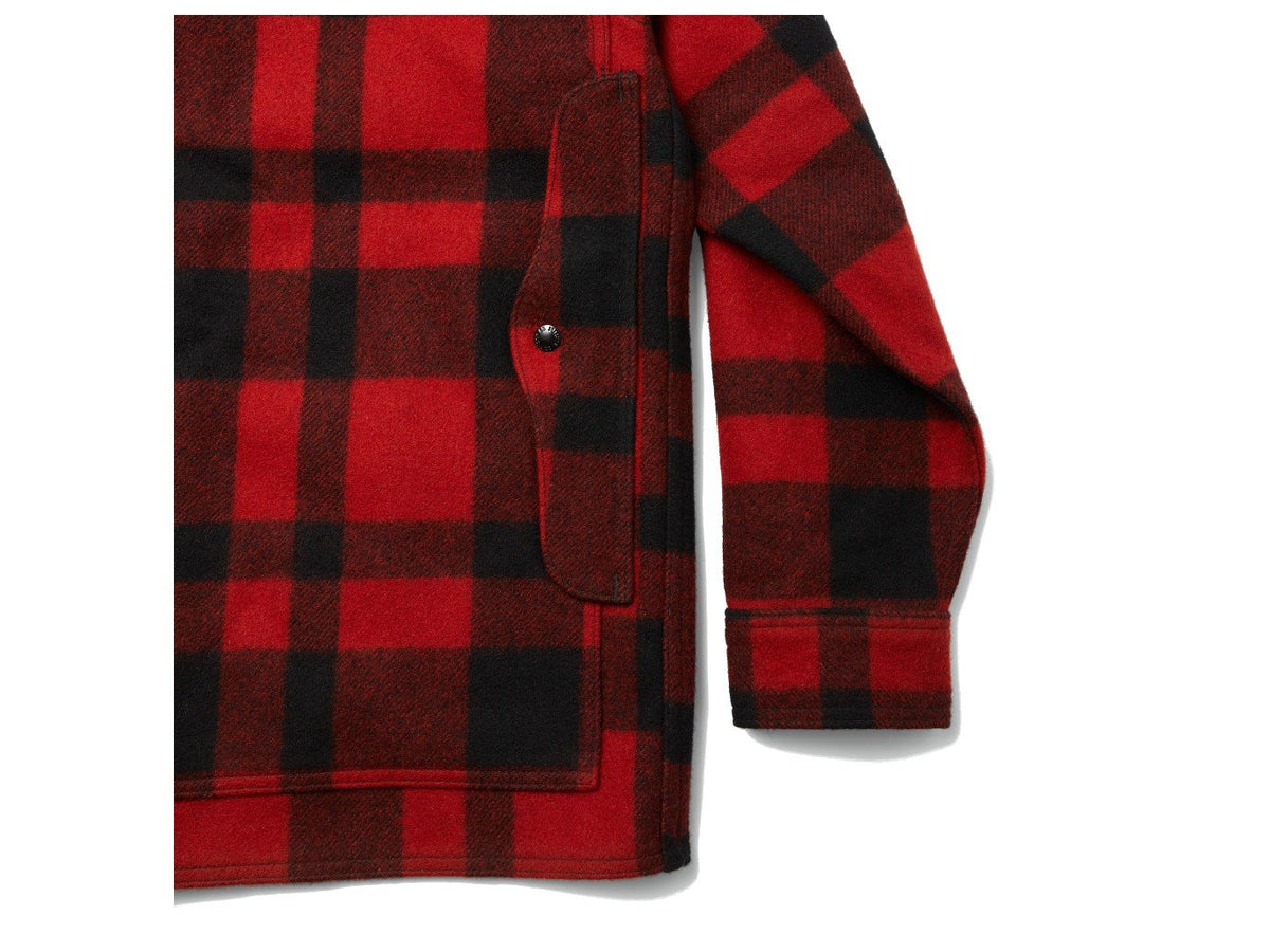 Close up view of Filson Mackinaw Cruiser jacket back pocket in red and black