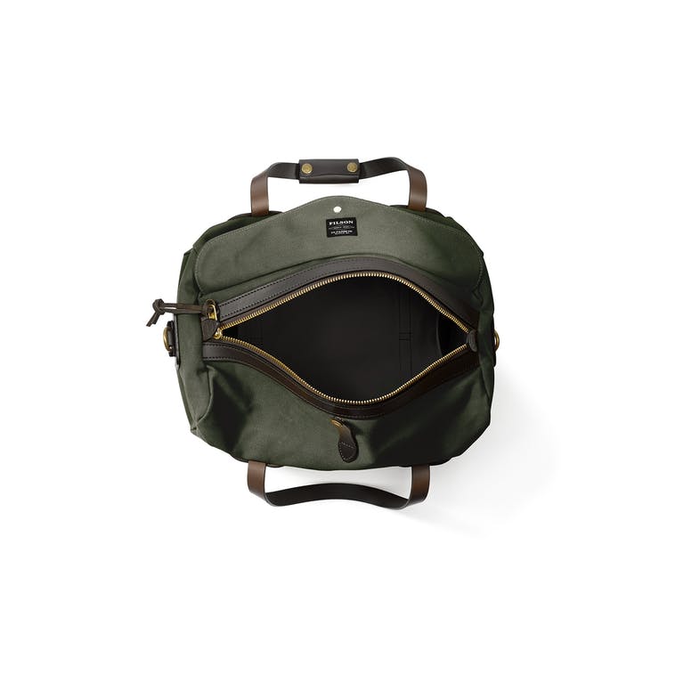 Top view of unzipped Filson Small Duffle bag in otter green