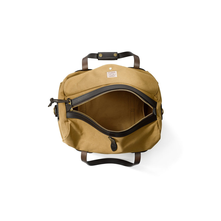 Top view of unzipped Filson Small Duffle bag in tan