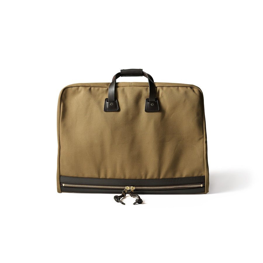 Front view of folded Filson Suit Cover bag in tan