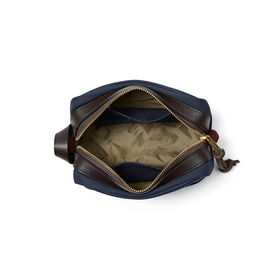 Top view of unzipped Filson Travel Kit bag in navy