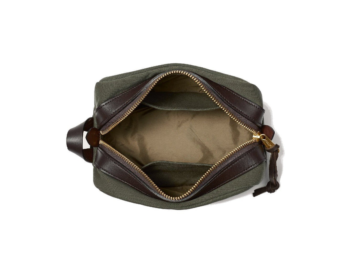 Top view of unzipped Filson Travel Kit bag in otter green