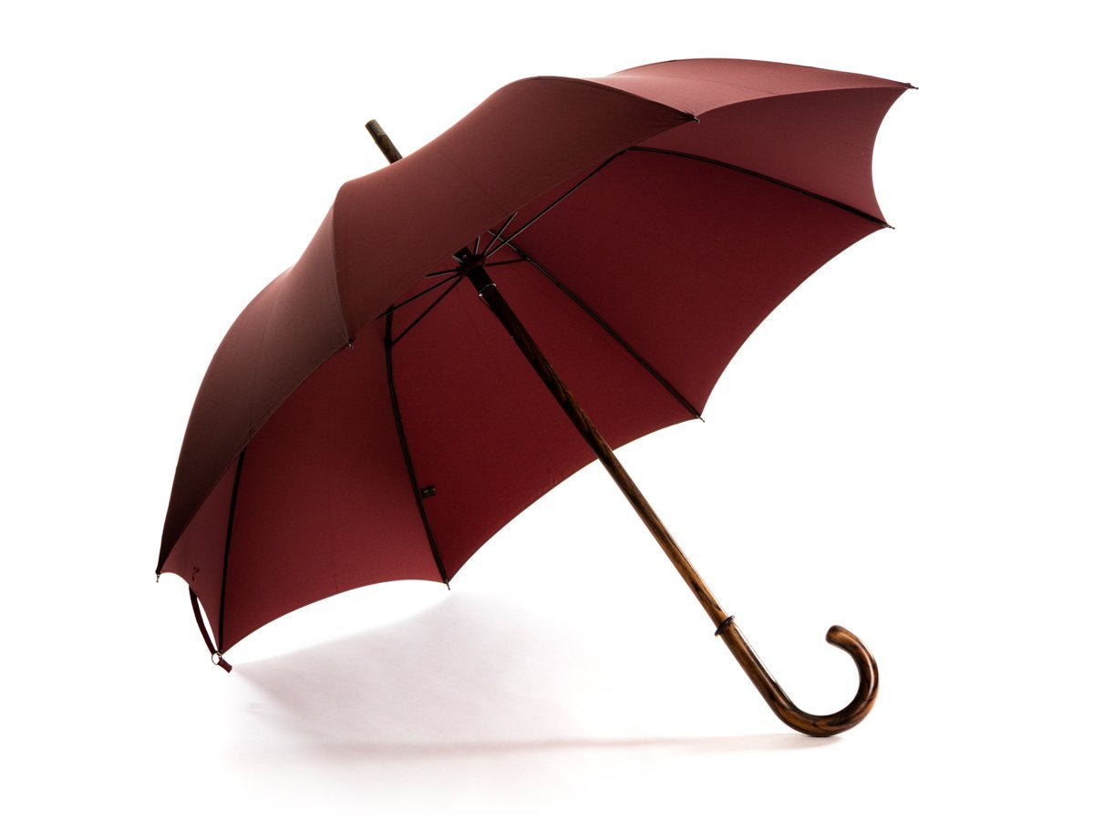Opened solid oak Fox Umbrella with burgundy canopy