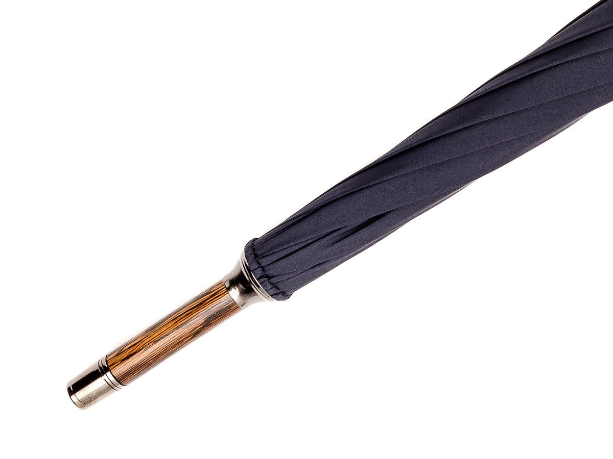 Tip end of solid oak Fox Umbrella with navy canopy
