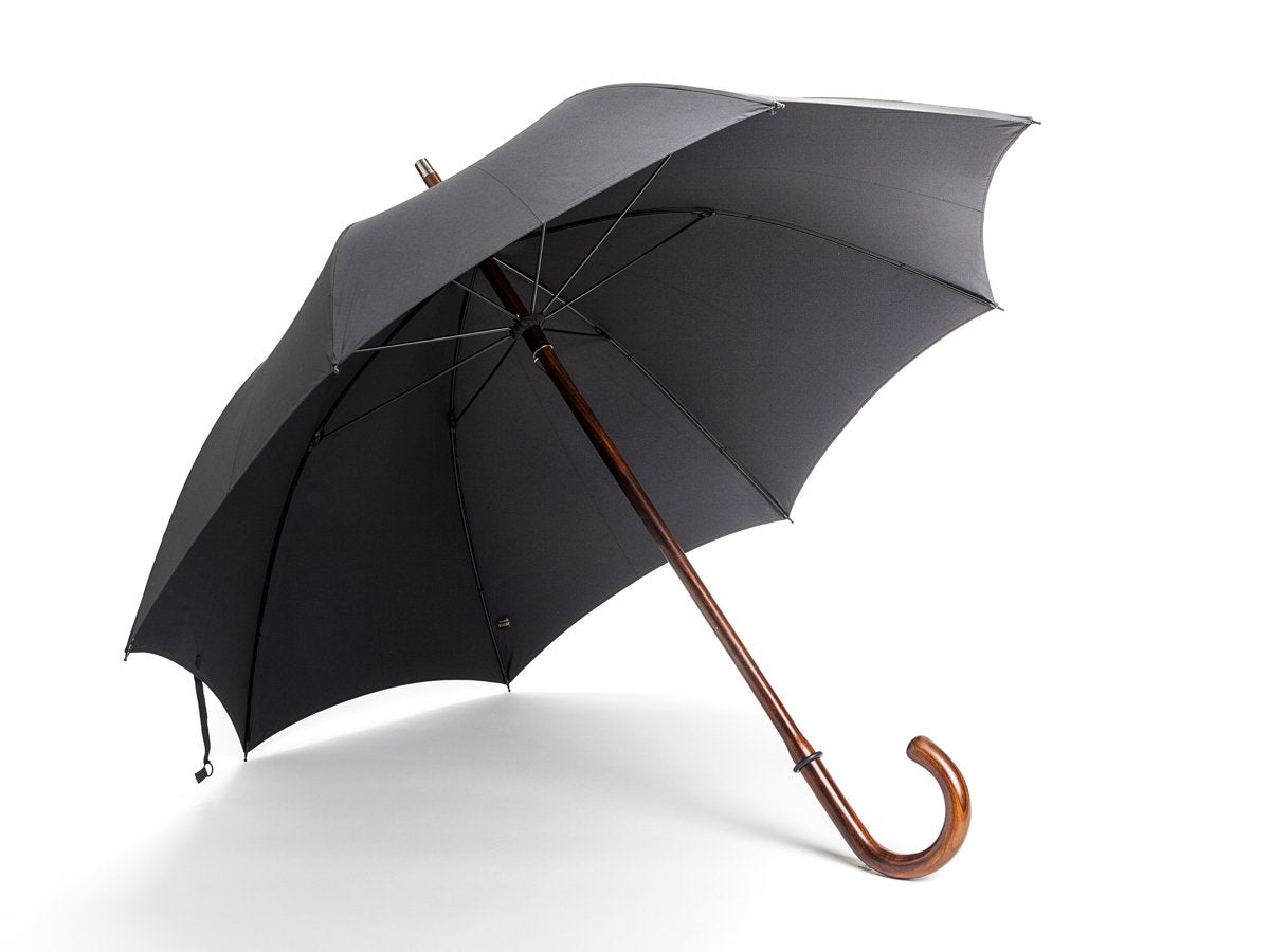 Opened solid polished cherrywood Fox Umbrella with black canopy