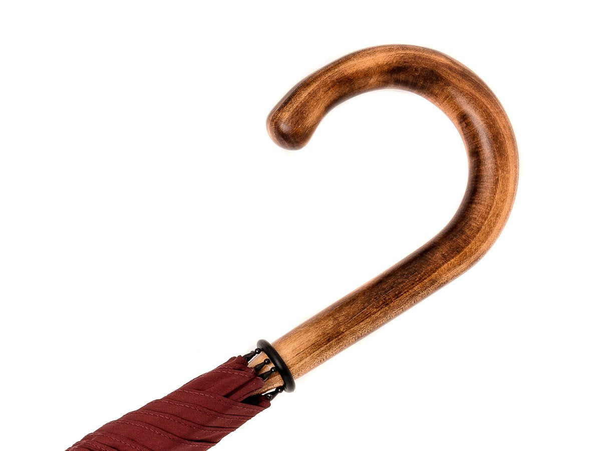 Handle of solid scorched maple Fox Umbrella with burgundy canopy