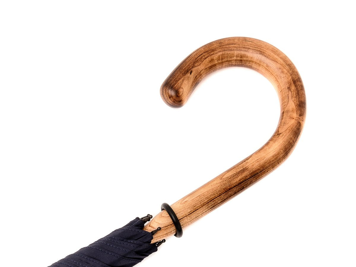 Handle of solid scorched maple Fox Umbrella with navy canopy