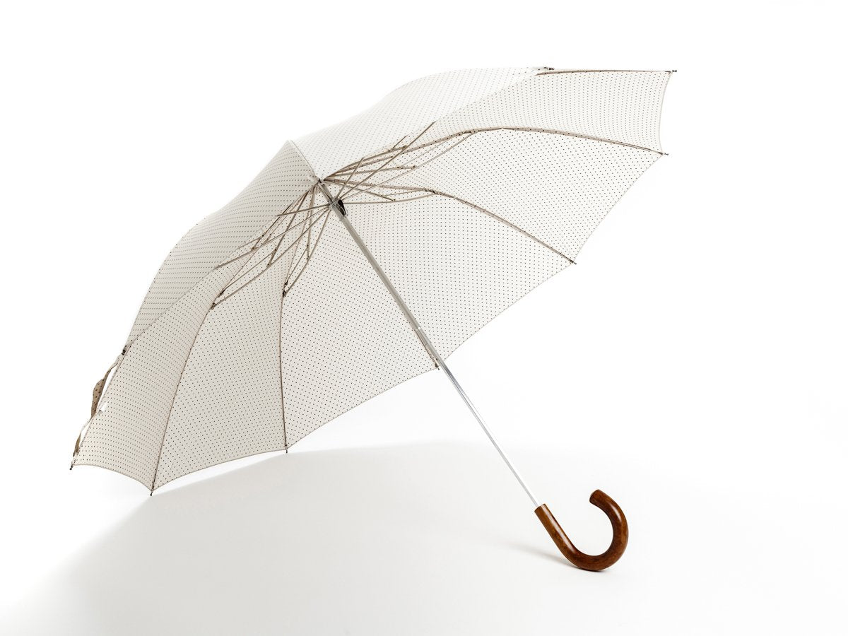 Opened malacca handle telescopic Fox Umbrella with ivory and brown polka dot canopy