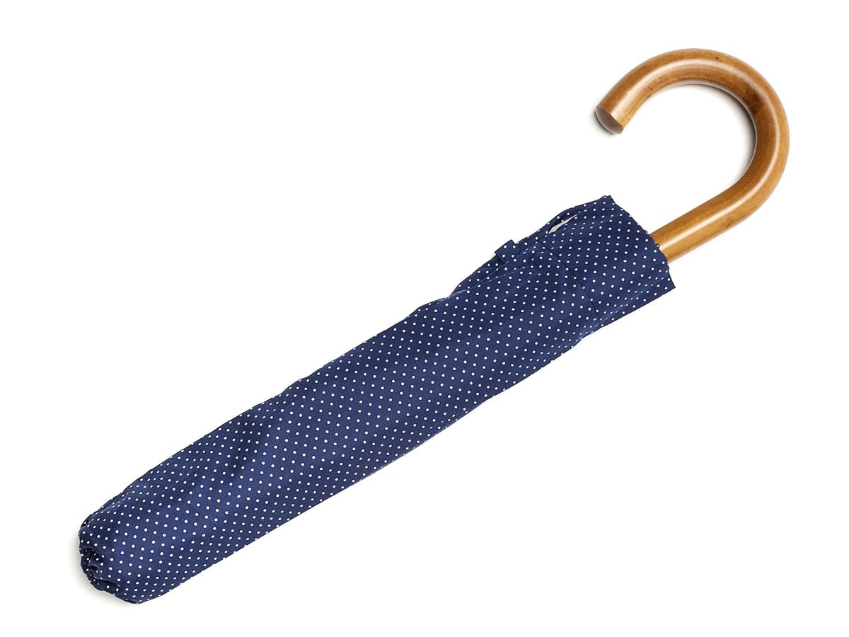 Canopy cover of malacca handle telescopic Fox Umbrella with navy and white polka dot canopy
