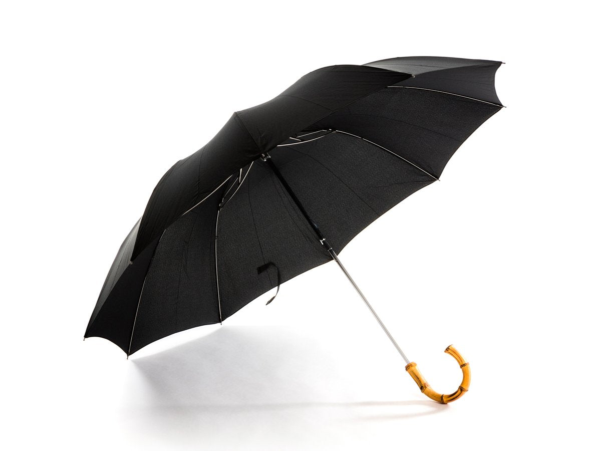 Opened whangee handle telescopic Fox Umbrella with black canopy