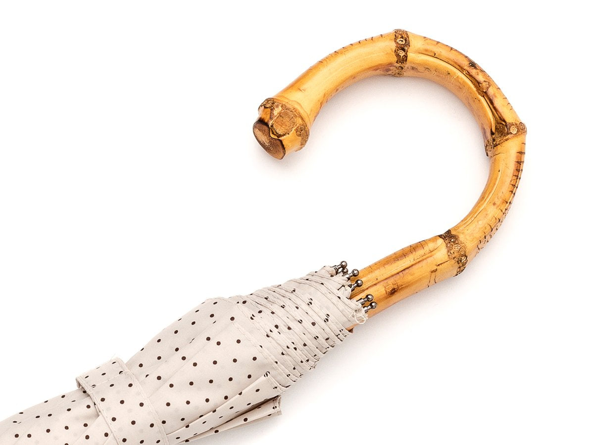 Whangee handle of telescopic Fox Umbrella with ivory and brown polka dot canopy