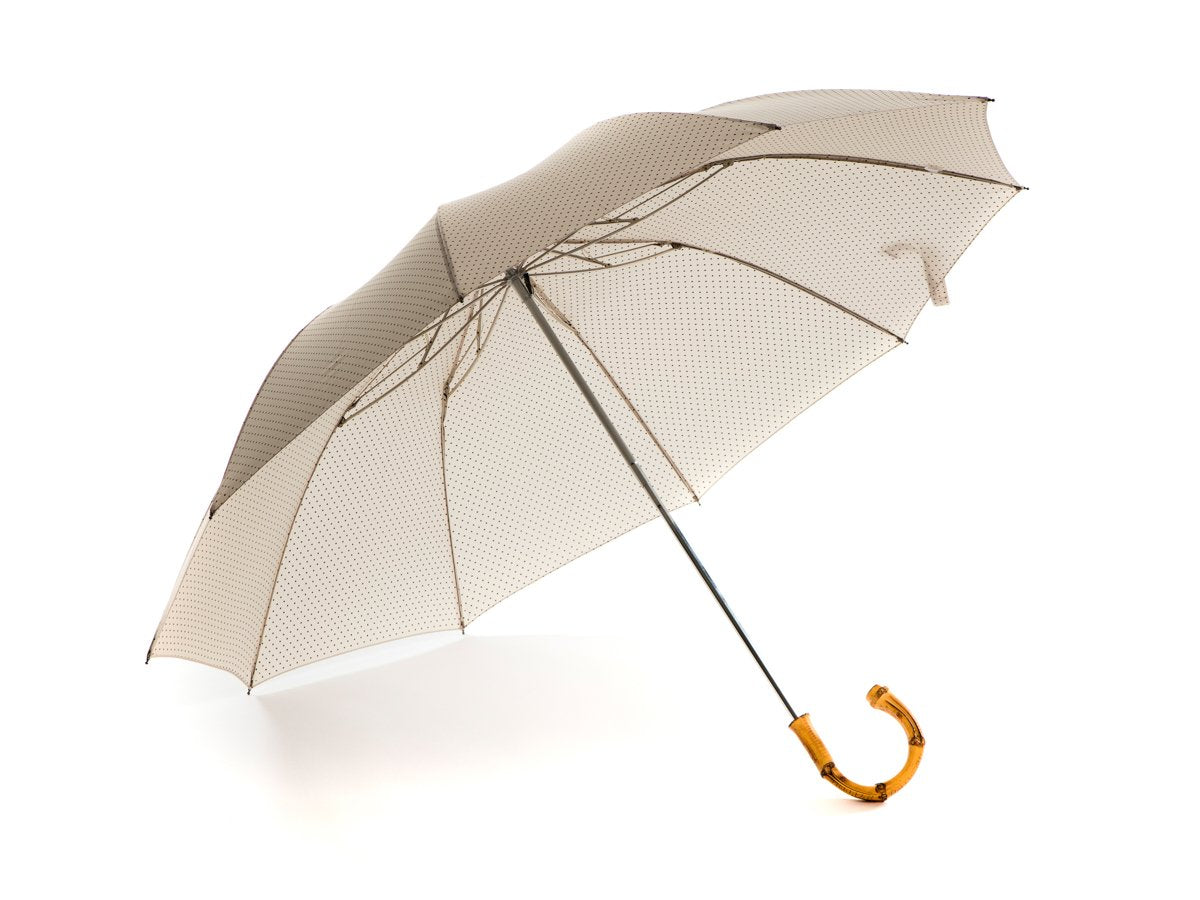 Opened whangee handle telescopic Fox Umbrella with ivory and brown polka dot canopy