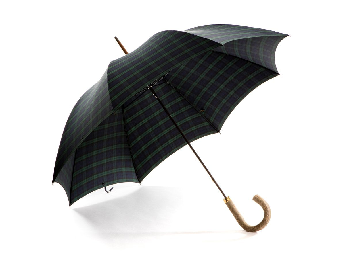 Opened ash handle tube Fox Umbrella with black watch tartan canopy