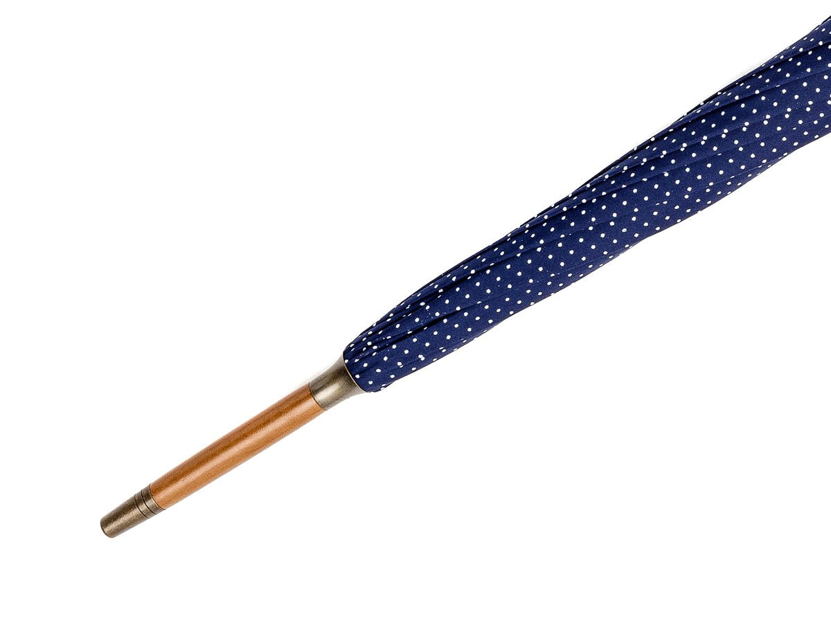 Tip end of ash handle tube Fox Umbrella with navy and white polka dot canopy