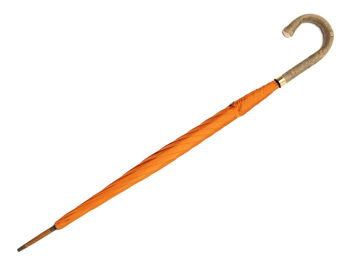 Full length view of ash handle tube Fox Umbrella with orange canopy