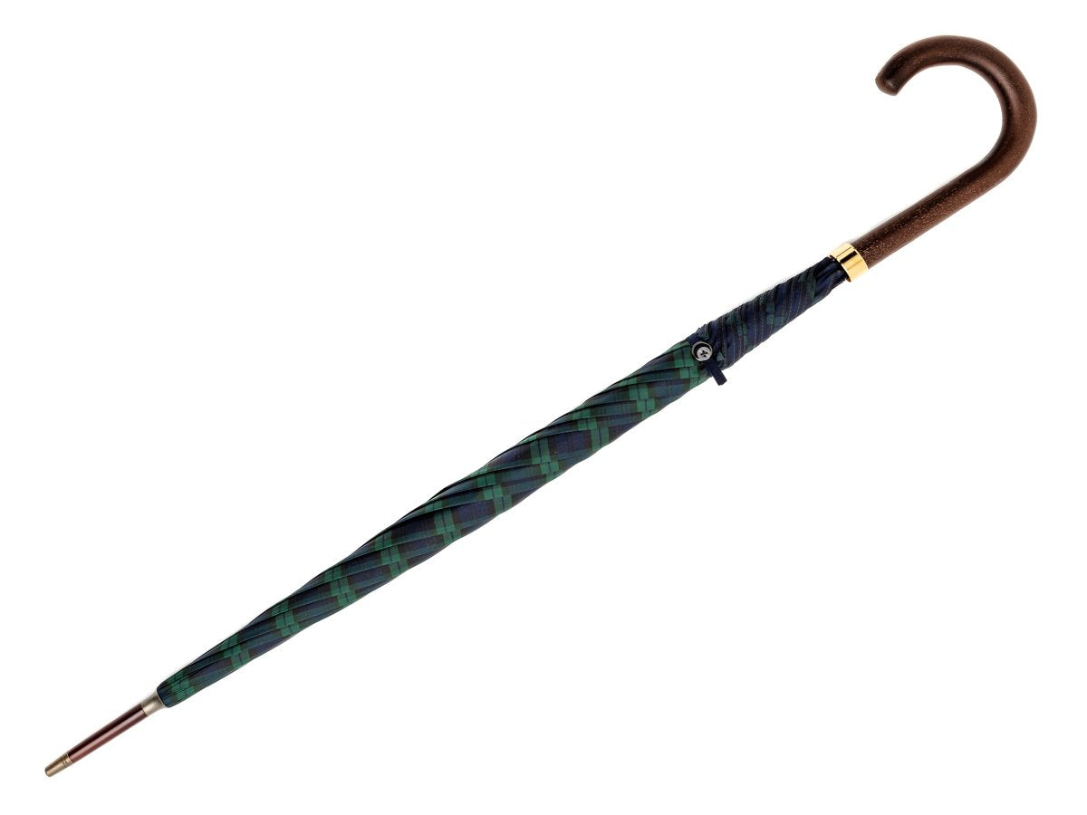 Full length view of dark brown wood handle tube Fox Umbrella with black watch tartan canopy
