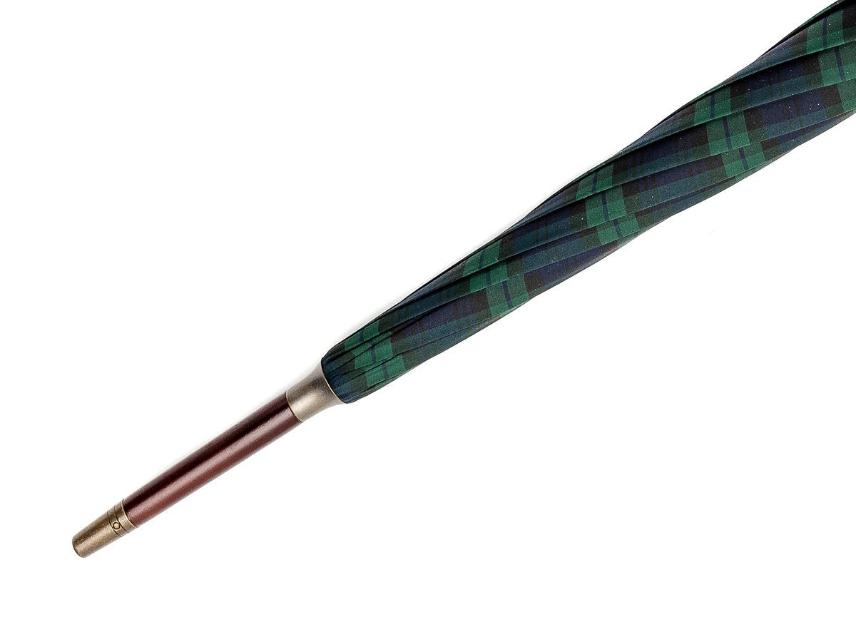 Tip end of dark brown wood handle tube Fox Umbrella with black watch tartan canopy