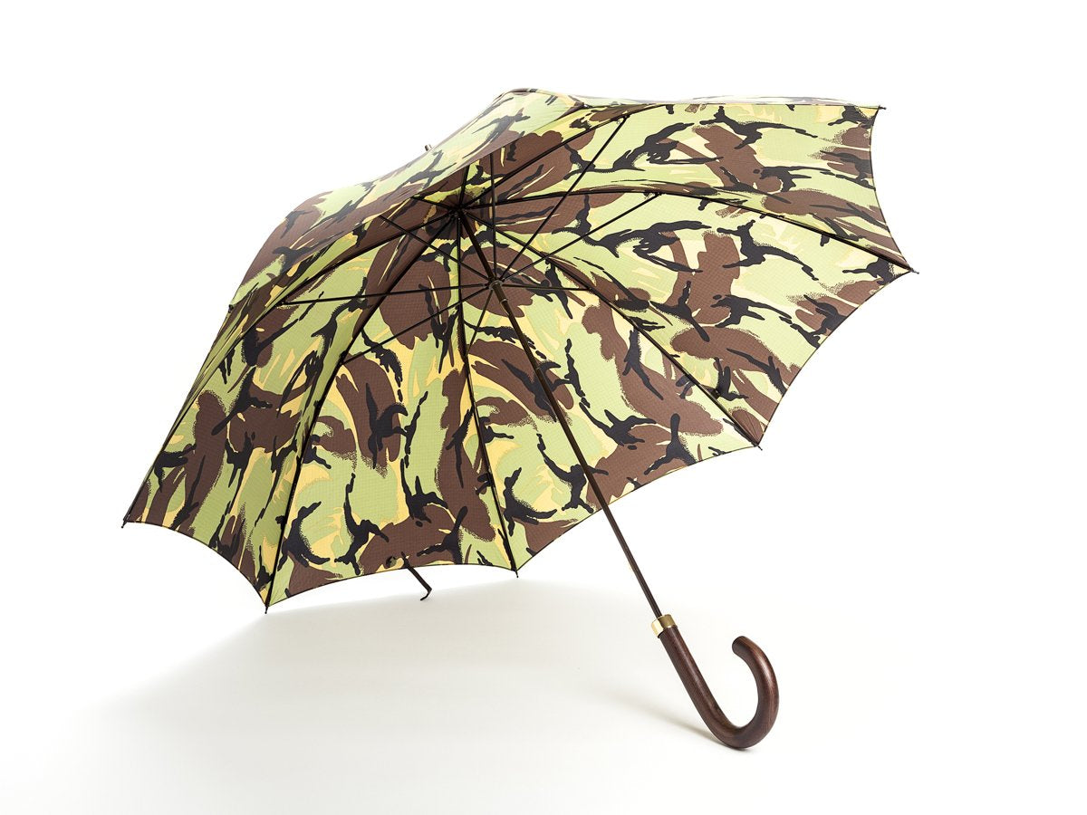 Opened dark brown wood handle tube Fox Umbrella with camouflage canopy