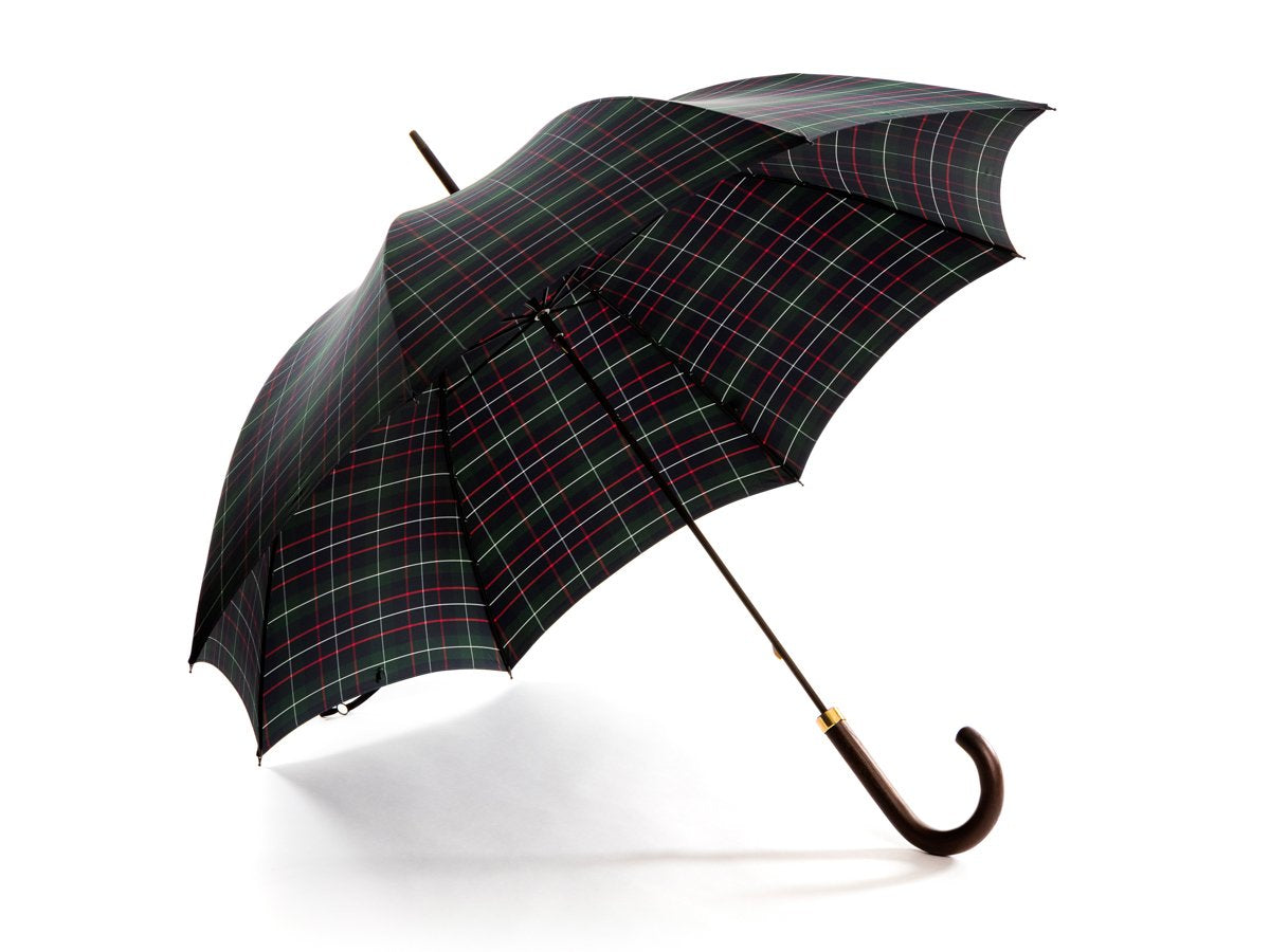 Opened dark brown wood handle tube Fox Umbrella with colquhoun tartan canopy