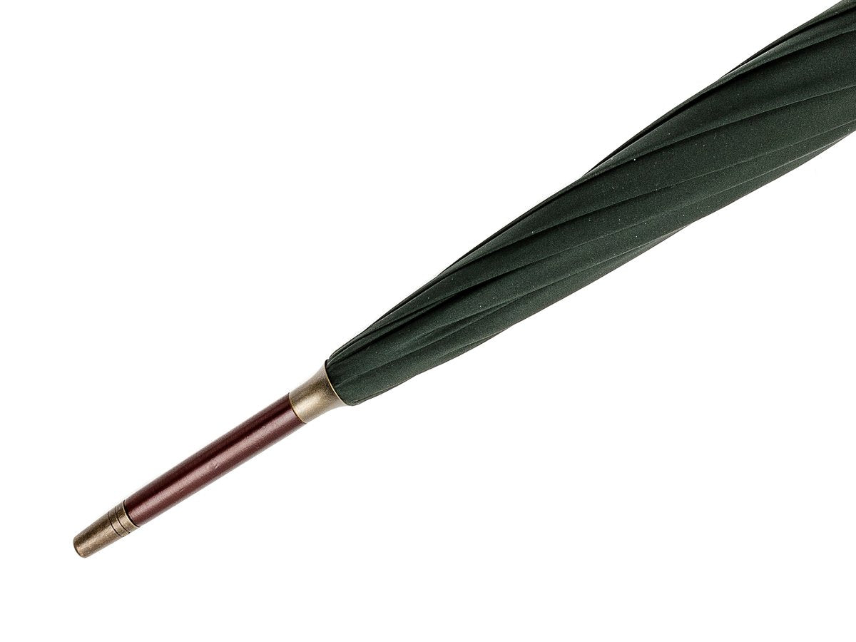 Tip end of dark brown wood handle tube Fox Umbrella with dark green canopy