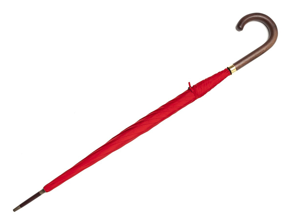 Full length view of dark brown wood handle tube Fox Umbrella with red canopy