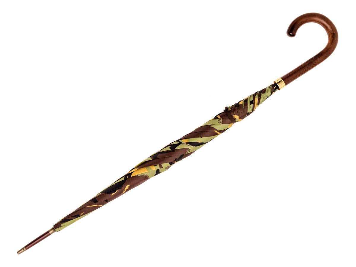 Full length view of dark grain wood handle tube Fox Umbrella with camouflage canopy