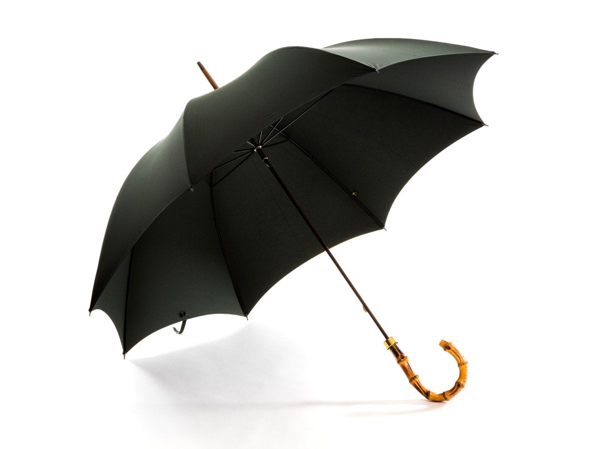 Opened whangee handle tube Fox Umbrella with dark green canopy