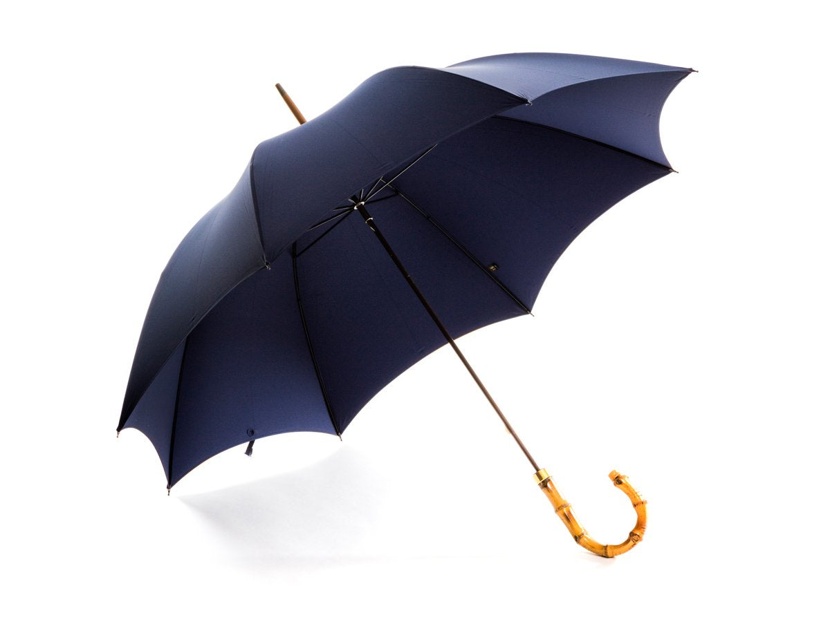 Opened whangee handle tube Fox Umbrella with french navy canopy