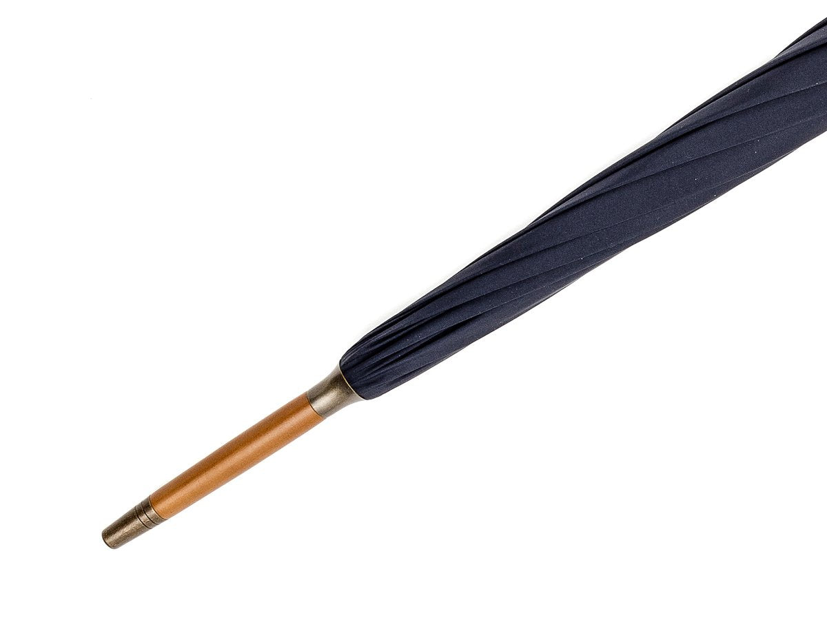 Tip end of whangee handle tube Fox Umbrella with navy canopy