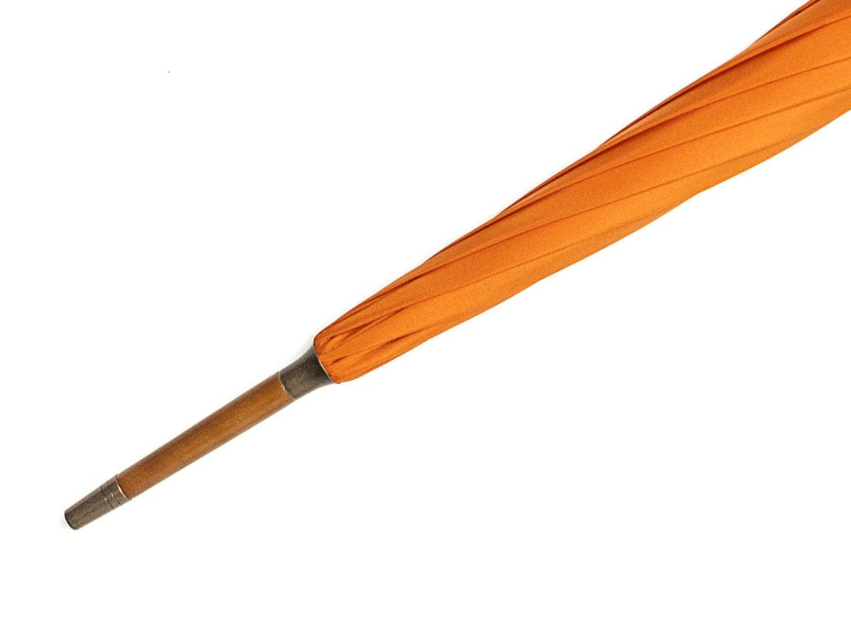 Tip end of whangee handle tube Fox Umbrella with orange canopy