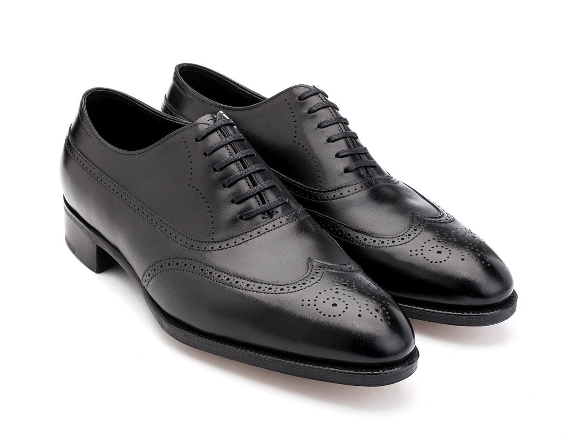 Front angle view of EE width John Lobb Cavendish wingtip full brogue balmoral oxford shoes in black oxford calf