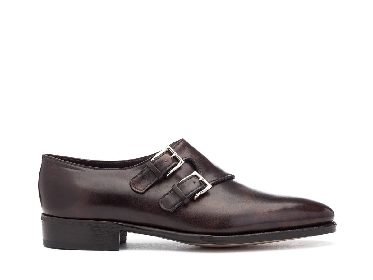 Side view of John Lobb Chapel plain toe swept back double monk strap shoes in dark brown museum calf