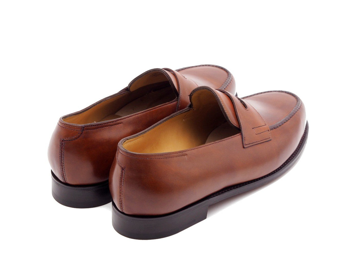 Back angle view of John Lobb Lopez penny loafers in chestnut misty calf