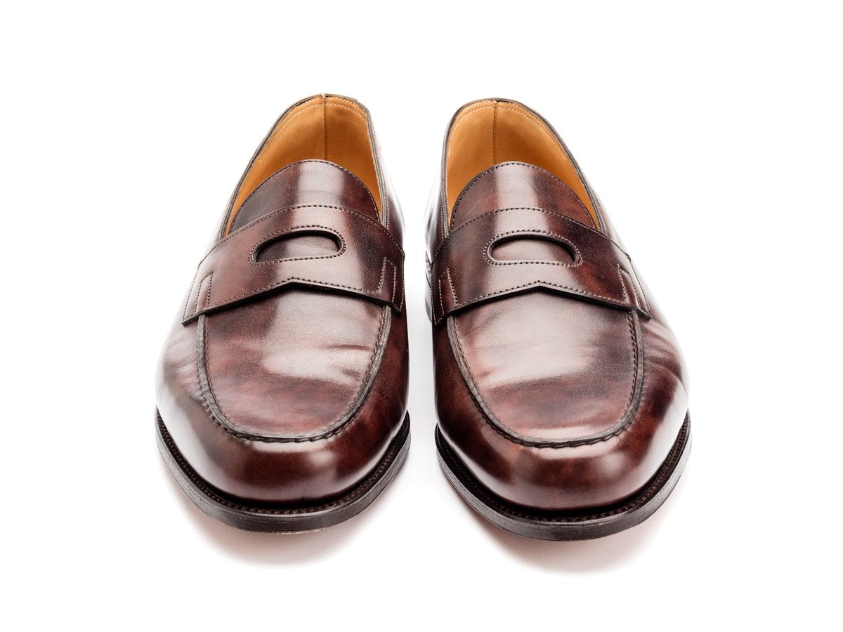 Front view of John Lobb Lopez penny loafers in dark brown museum calf