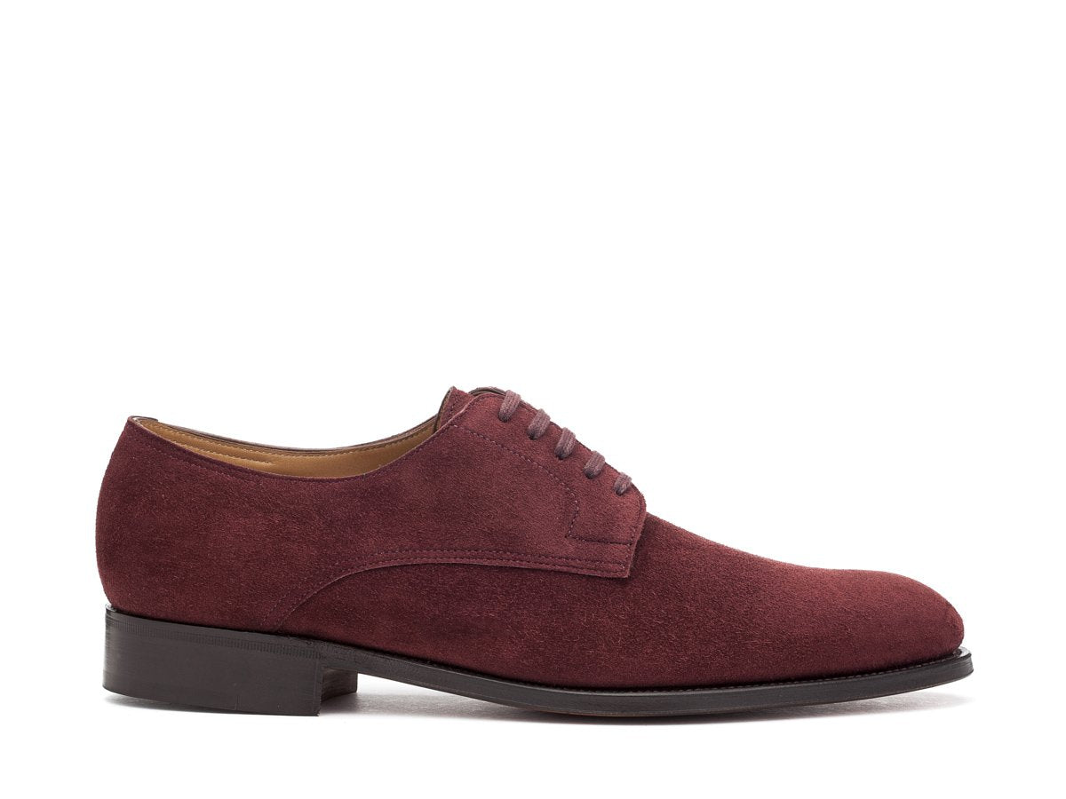 Side view of EE width John Lobb Penzance plain toe derby shoes in burgundy suede