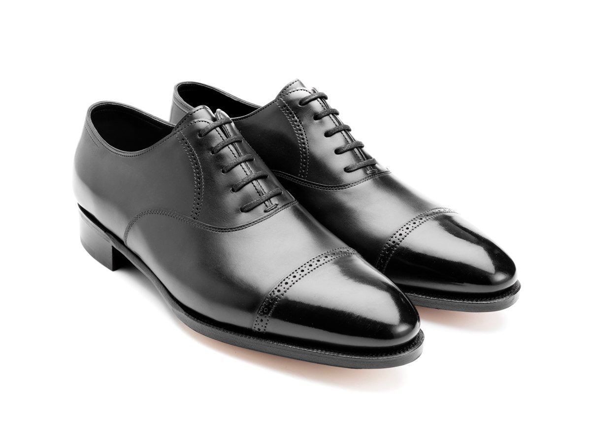 Front angle view of John Lobb Philip II quarter brogue oxford shoes in black oxford calf
