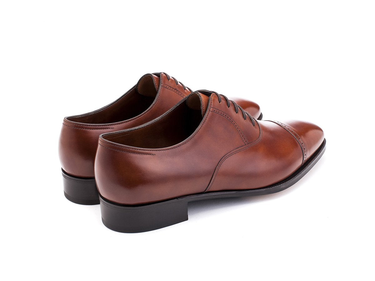 Back angle view of John Lobb Philip II quarter brogue oxford shoes in chestnut misty calf