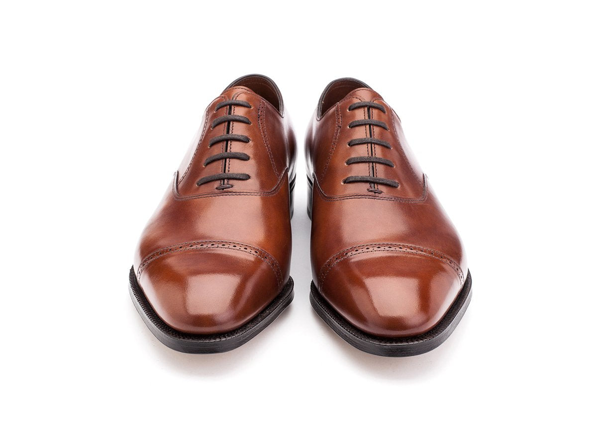 Front view of EE width John Lobb Philip II quarter brogue oxford shoes in chestnut misty calf