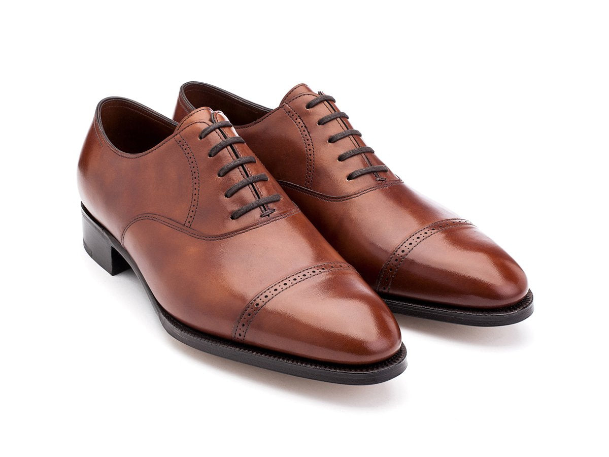 Front angle view of John Lobb Philip II quarter brogue oxford shoes in chestnut misty calf