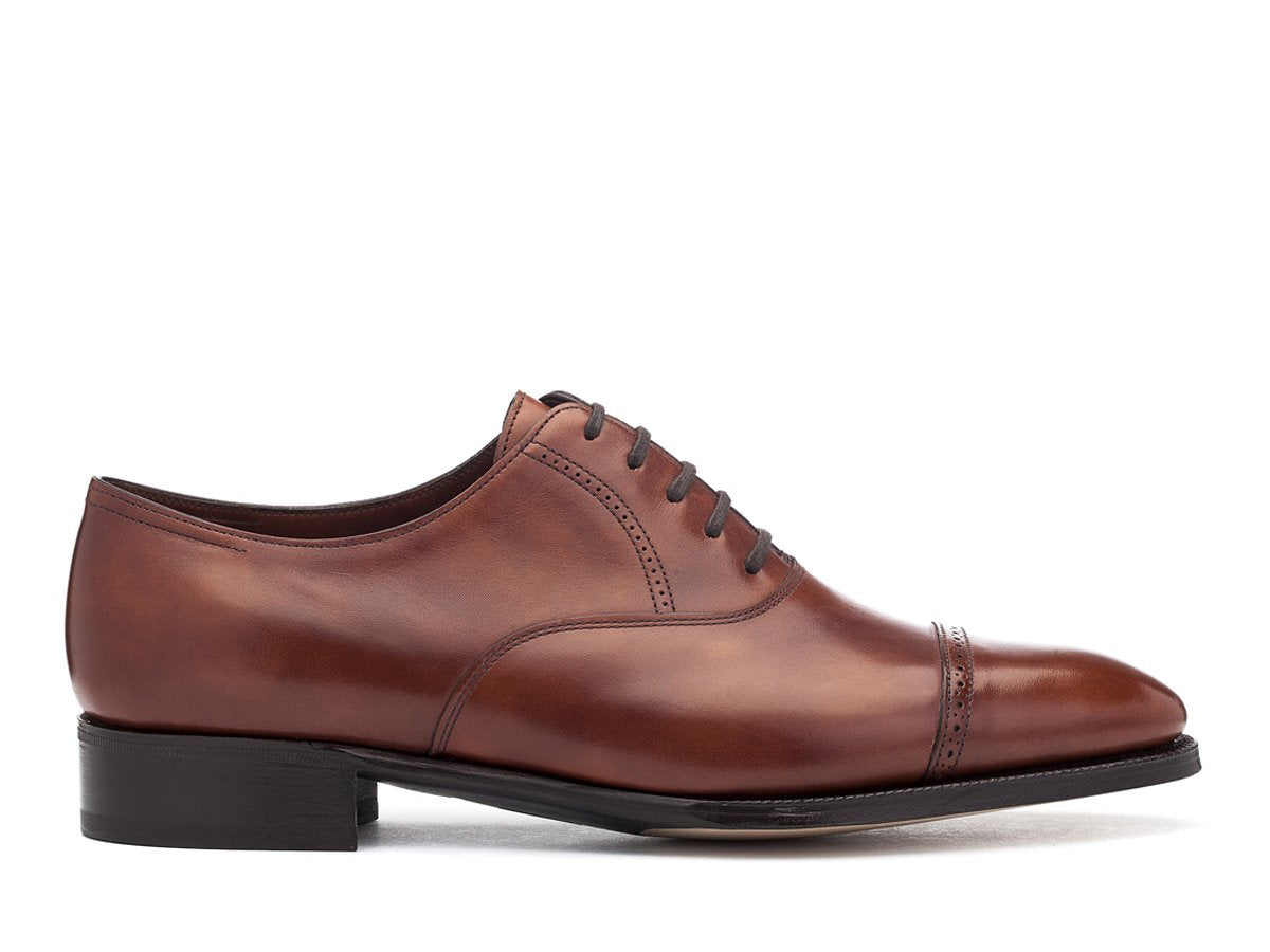 Side view of John Lobb Philip II quarter brogue oxford shoes in chestnut misty calf