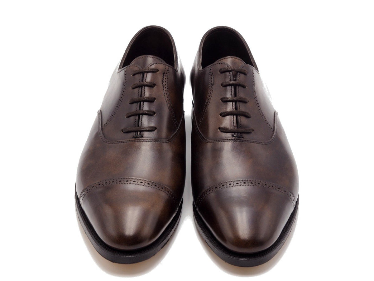 Front view of John Lobb Philip II quarter brogue oxford shoes in dark brown museum calf