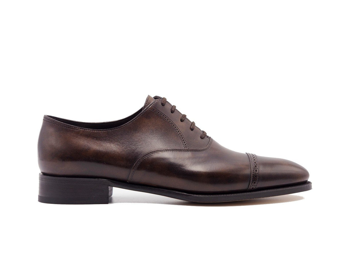 Side view of John Lobb Philip II quarter brogue oxford shoes in dark brown museum calf