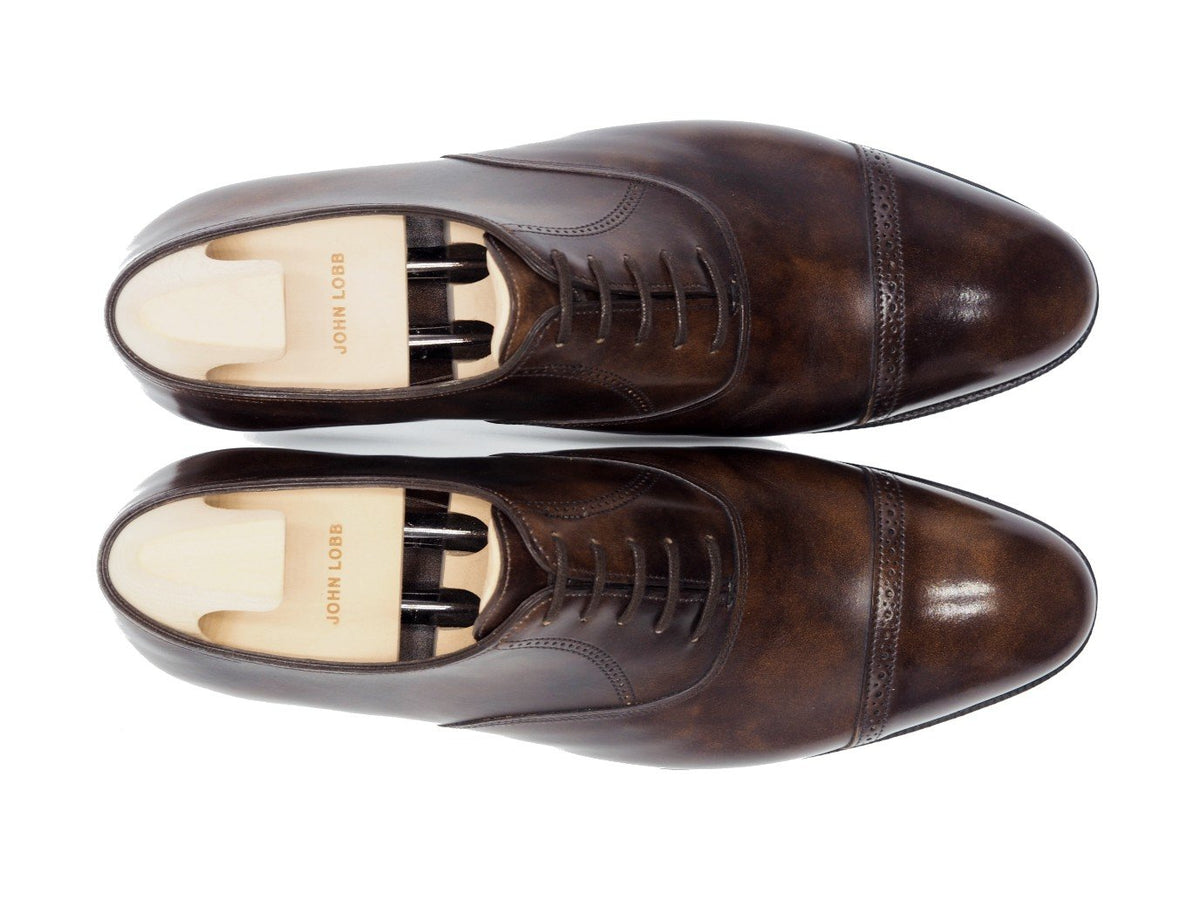 Top view of John Lobb Philip II quarter brogue oxford shoes in dark brown museum calf with shoe trees